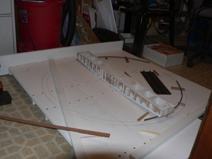 October 11, 2006.  I made a base from wider strips of TUF board, reinforced with strips underneath. I glued everything and then used deck screws to clamp it in place. 