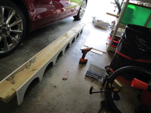 I'm using the 2x6 to help keep things straight while I put the two sections together.

Currently that 2x6 is just keeping it straight and is not yet attached to anything.